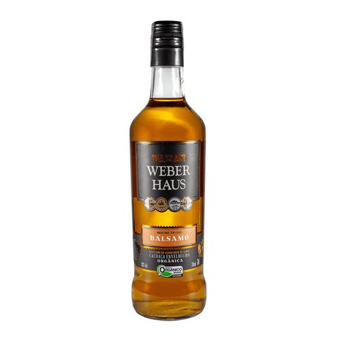 Garrafa de Cachaça Bálsamo Weber Haus 700ml, cachaça orgânica com notas herbais e amadeiradas.